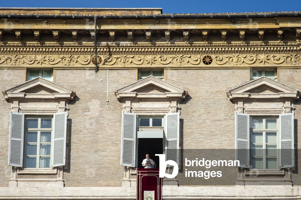 Pope Francis addresses worshipers from the window of the Apostolic Palace overlooking St, Peter's Square during the weekly Angelus prayer, 2019 (photo)
