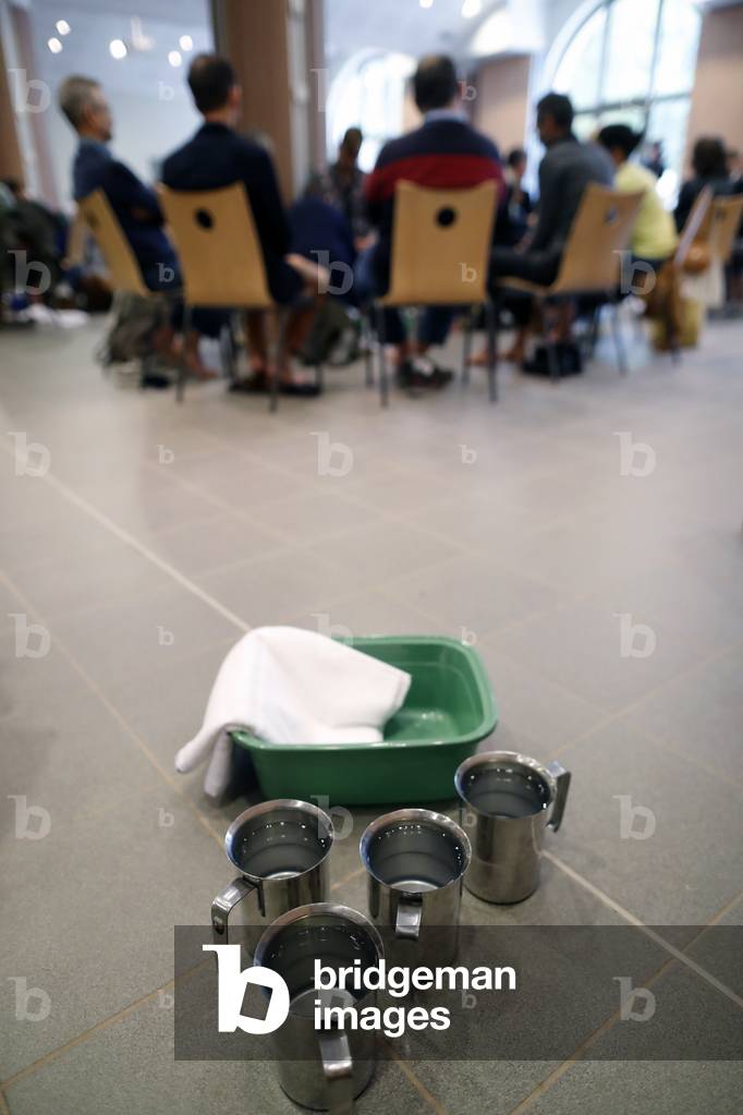 Feet washing ritual in a catholic church, Paray le Monial, France (photo)