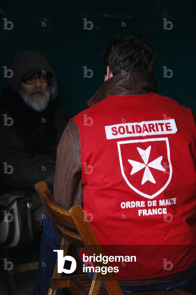 Homeless person with a Malta Order volunteer, Paris, France