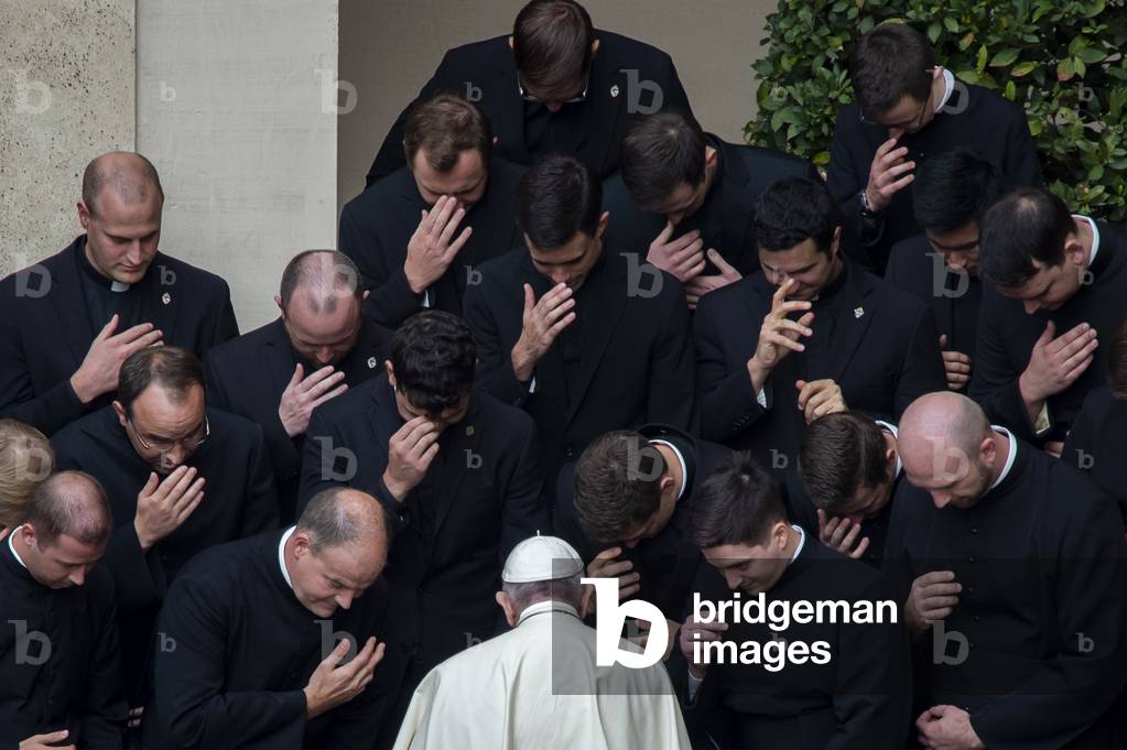 Pope Francis prays with priests at the end of a limited public audience at the San Damaso courtyard in The Vatican on September 30, 2020 during the COVID-19 infection, caused by the novel coronavirus.