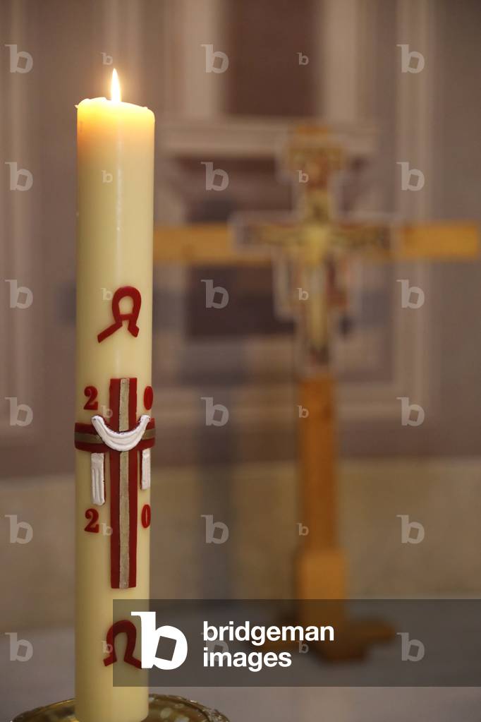 Catholic church. Paschal candle. A new Paschal candle is blessed and lit every year at Easter. France.