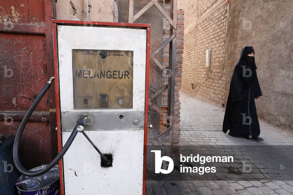 The medina (old town), Muslim woman, Marrakech, Morocco