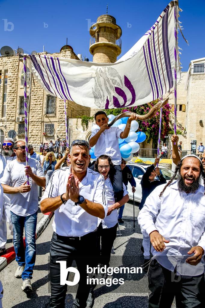 Group heading for the western wall to celebrate a bar mitsvah, Jerusalem, israel. (photo)