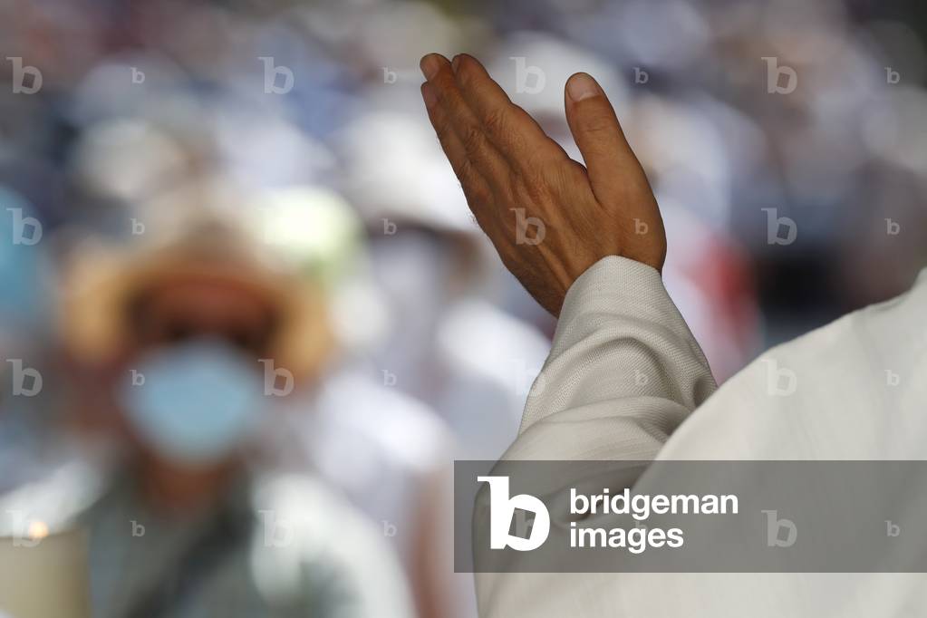 Catholic church during covid-19 epidemic. Catholic mass. Priest praying. 

 France.