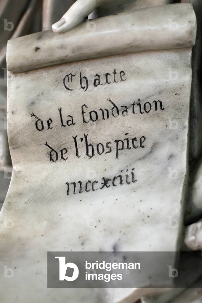 Detail of a statue depicting St Louis's sister in law Marguerite de Bourgogne, founder of the Hotel Dieu hospital and chuch, Tonnerre, France
