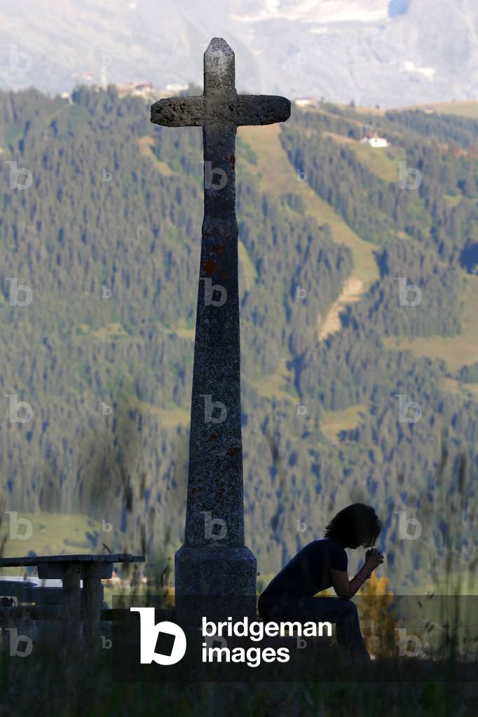 Woman praying, Megeve, France