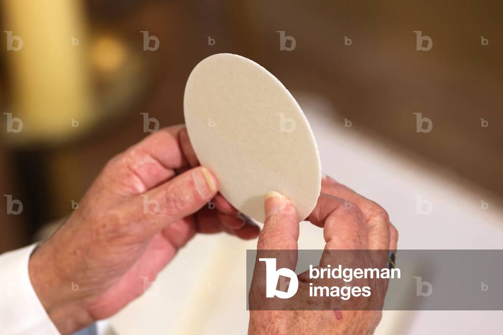 Catholic church during covid-19 epidemic. Sunday mass. Eucharistic celebration.  Sanctuary of La Benite Fontaine. France.