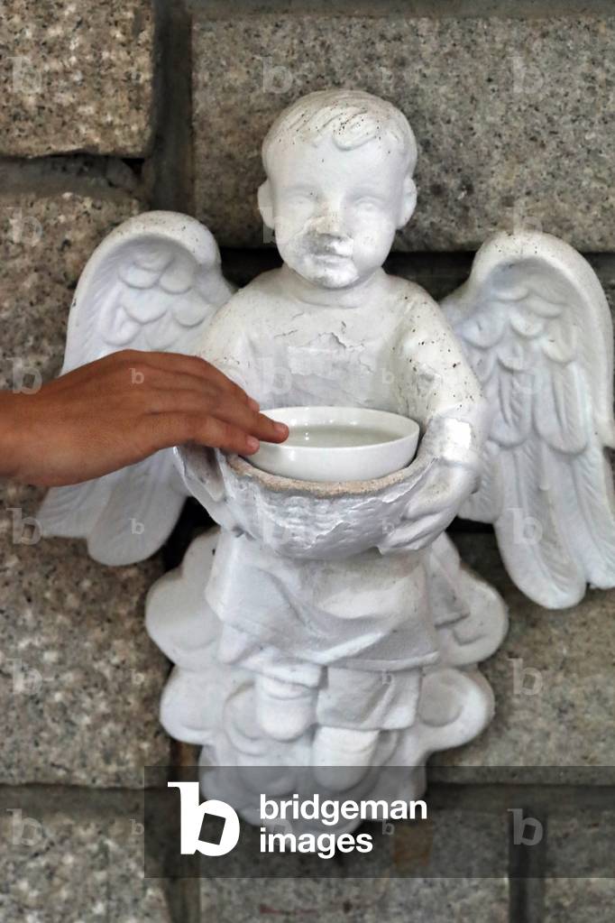 Cistercian Abbey, Our Lady of My Ca, Angel holy water font, Vietnam, 2019 (photo)
