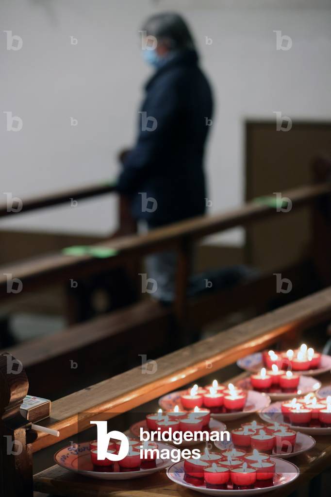 Catholic church during covid-19 epidemic. Commemoration of All the Faithful Departed. Catholic mass. Church candels.  Saint Joseph church.  France.