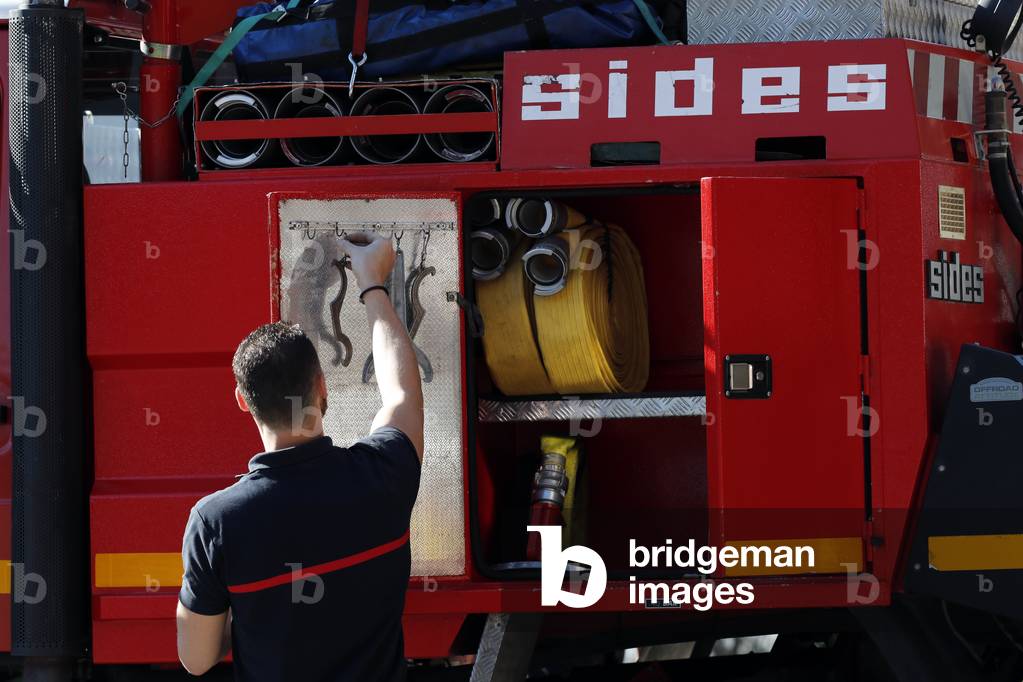 Fire department. Emergency vehicule. Sprinkler system. French Sapeurs Pompiers. France.