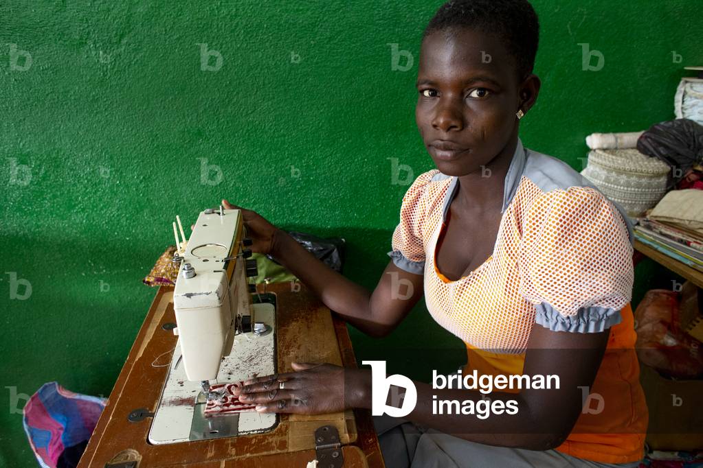 Young apprentice seamstress trained by a catholic NGO in Dapaong, Togo, 2019 (photo)