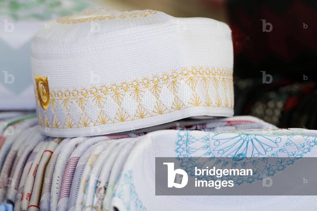 The National Mosque or Masjid Negara, Muslim hats (Kufi) for sale, Kuala Lumpur, Malaysia (photo)