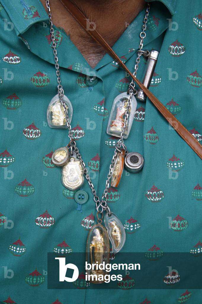 Thai wearing amulets in Hua Hin. Thailand
