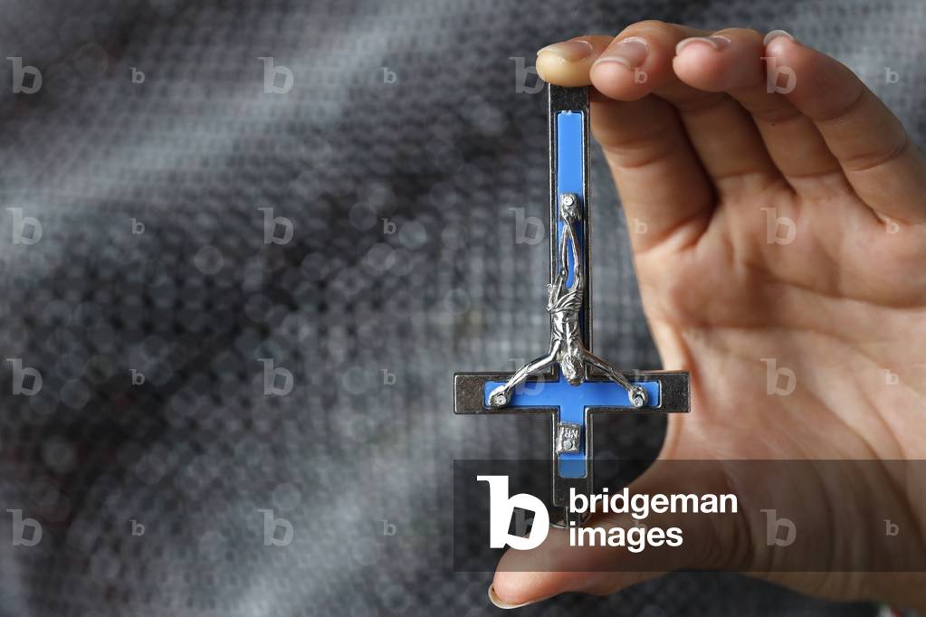 Inverted crucifix is an anti-Christian symbol, Ho Chi Minh City, Vietnam, 2019 (photo)
