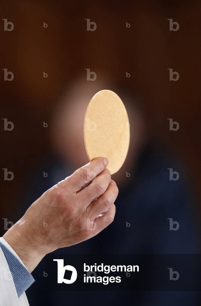 Roman catholic mass.  Eucharist celebration. Saint-Nicolas de Veroce church. France. (photo)