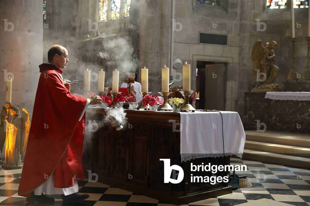 Pentecost mass in St Nicolas's church, Beaumont-le-Roger, France