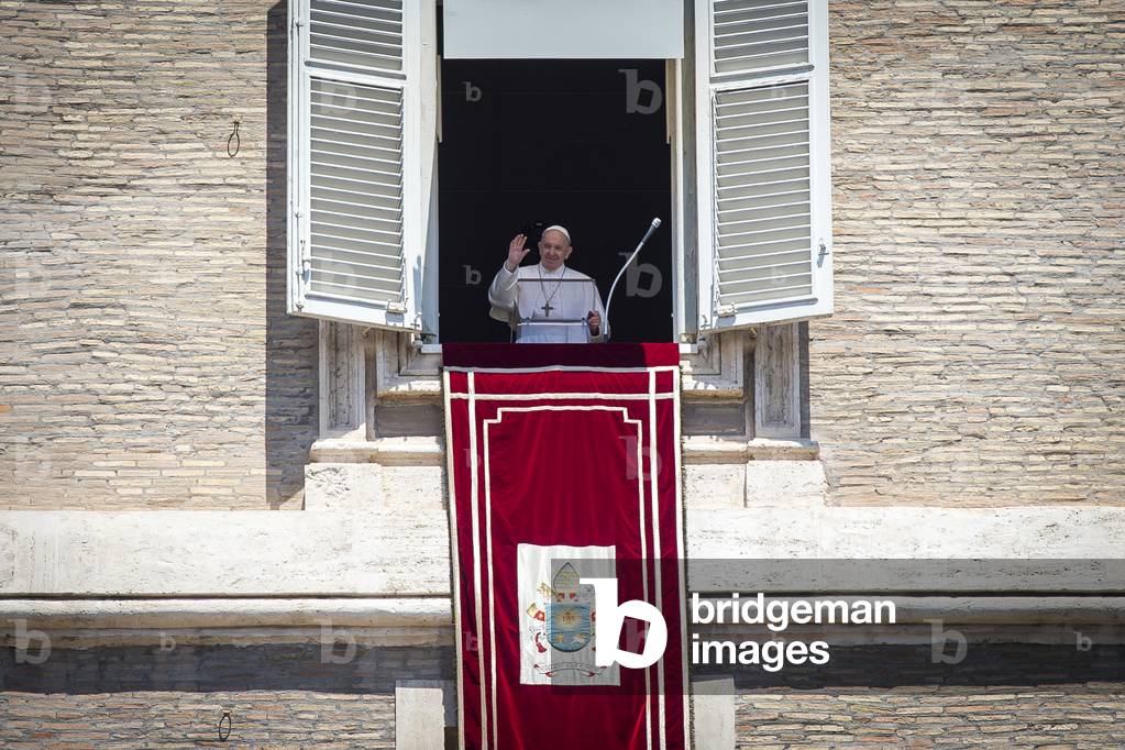Pope Francis delivers his blessing during the Regina Coeli from the window of his private studio at Apostolic Palace overlooking St. Peter's Square in Vatican City, Vatican on May 31, 2020.