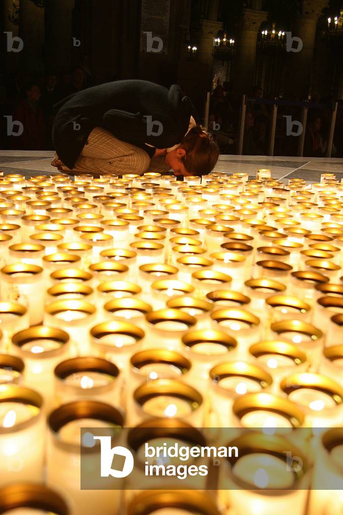 Night vigil in Notre Dame de Paris cathedral, Paris, France