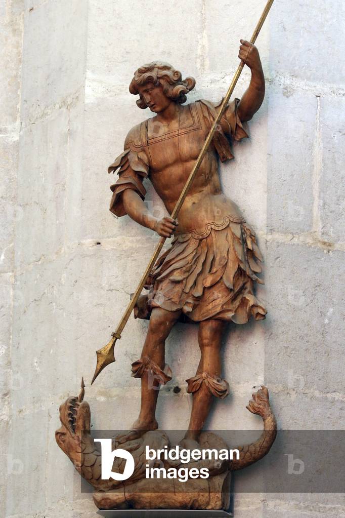 Saint-Claude, Jura, France, le 31/8/2015 - St Michael defeating evil. Saint-Claude Cathedral.