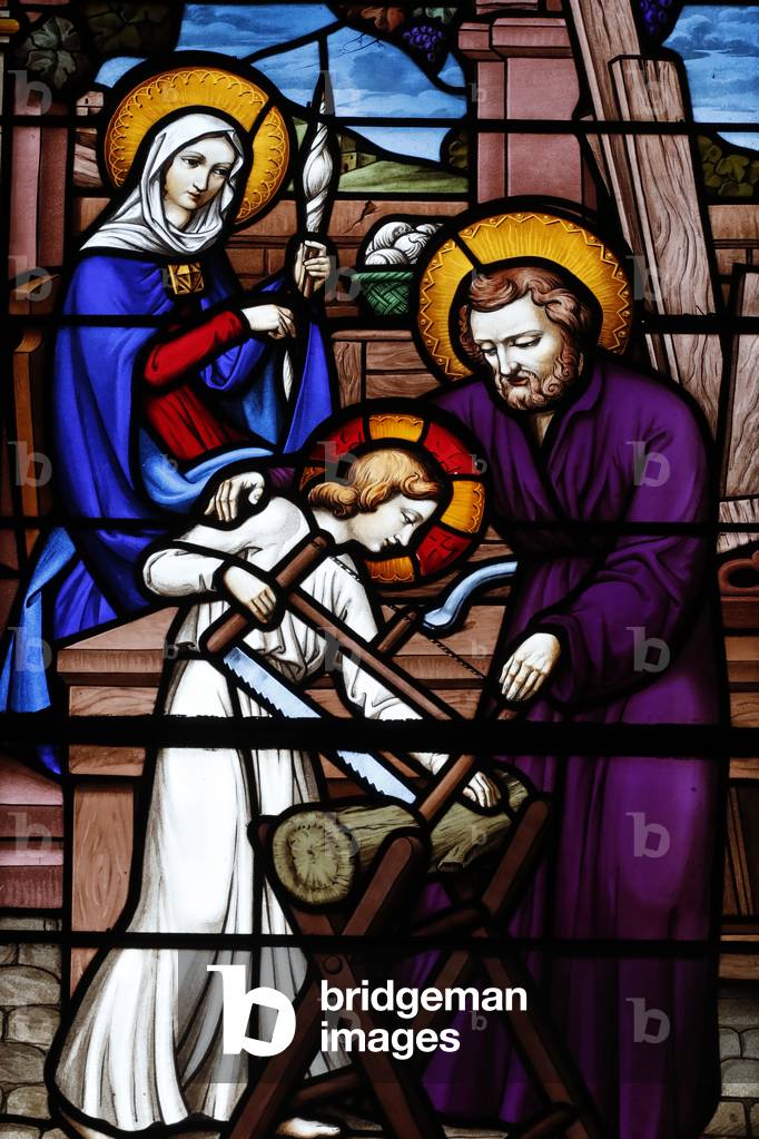 Stained glass window. Holy family. Joseph the carpenter.  France.