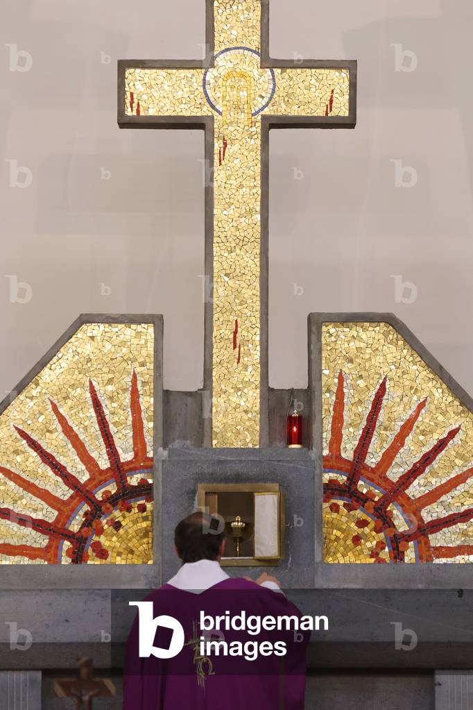 Catholic church during covid-19 epidemic. Sunday mass.  Priest at eucharistic celebration.  Saint Joseph church.  France.