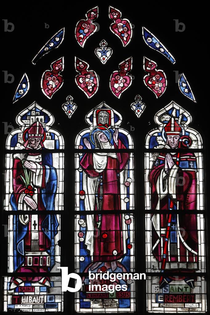 Stained glass in Notre Dame collegiate church, Poissy, France. St Thibaut, St. Therese and  St Erembert (bishop of Toulouse)