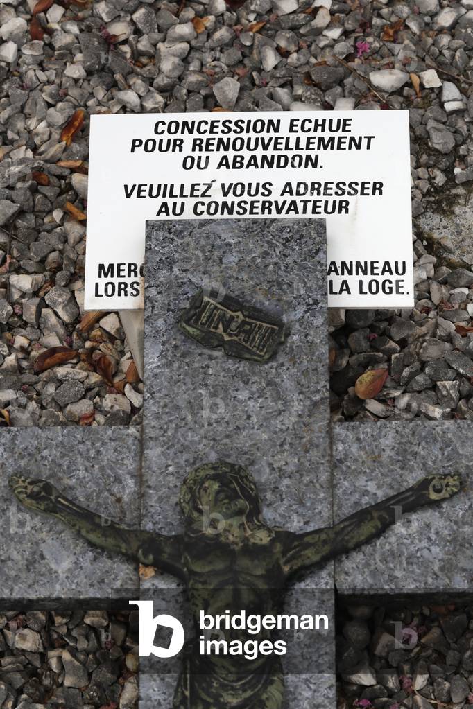 Grave in cemetery.  Crucifix. Jesus on the cross.  Annecy. France.