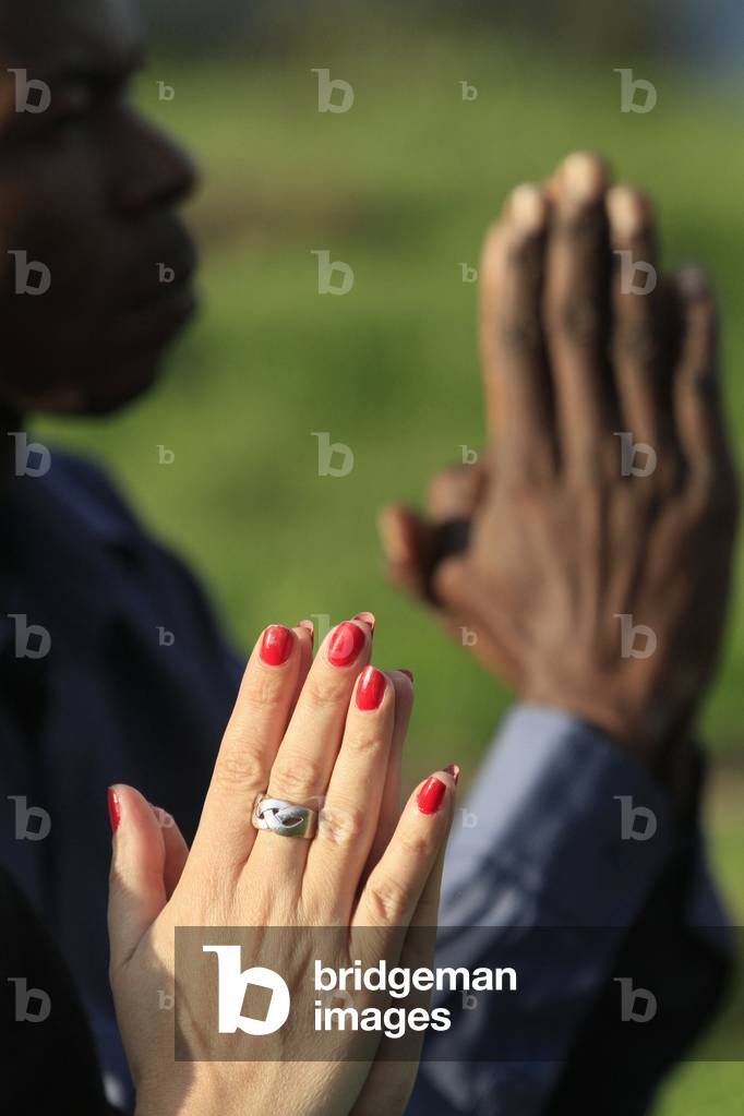 Man and woman praying in the mountain. Saint-Gervais France