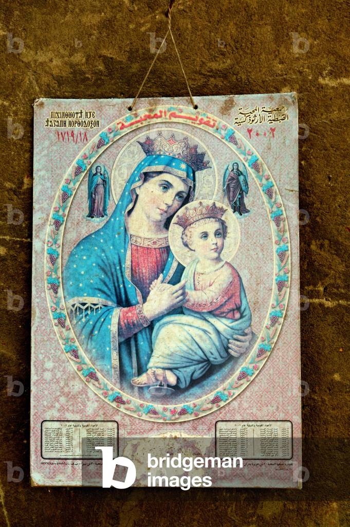 Image pieuse placardee sur les murs du quartier copte au Caire.