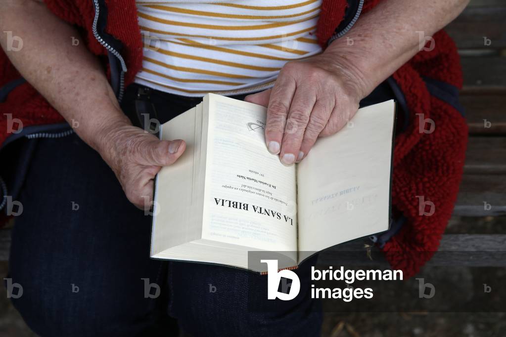 Senior woman reading the bible in Eure, France, 2019 (photo)