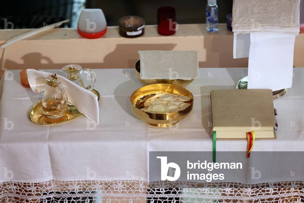 Catholic church during covid-19 epidemic. Sunday mass. Eucharistic table.  France.