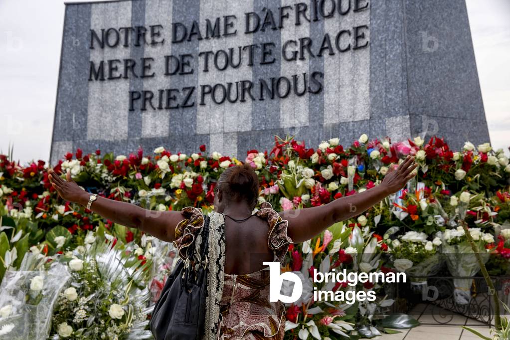 Woman praying at Our Lady of Africa catholic sanctuary, Abidjan, Ivory Coast. (photo)