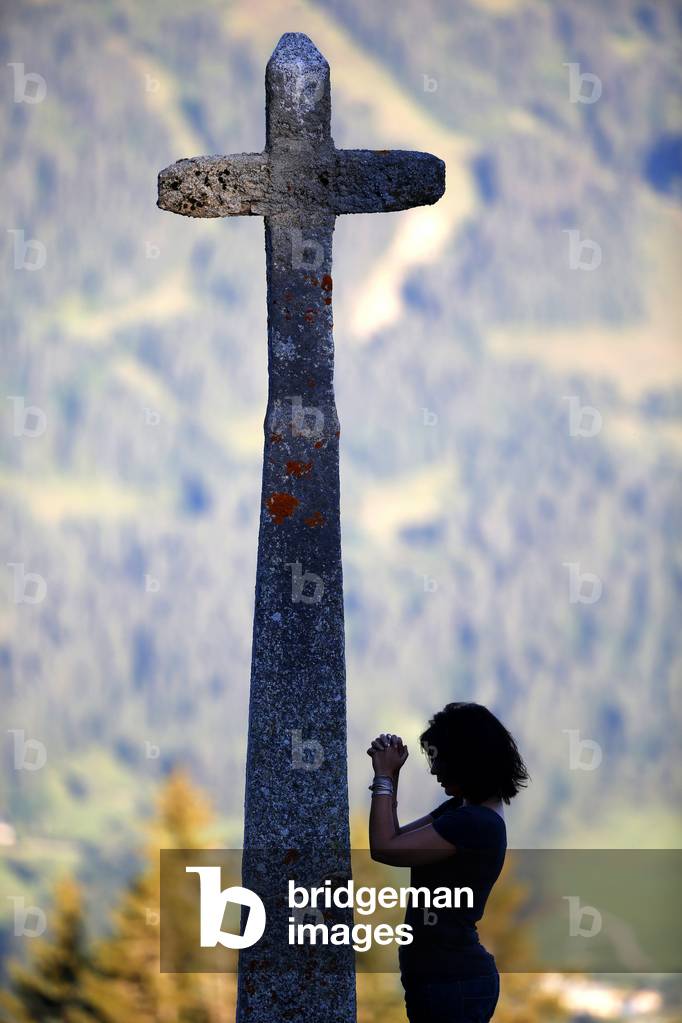 Woman praying, Megeve, France