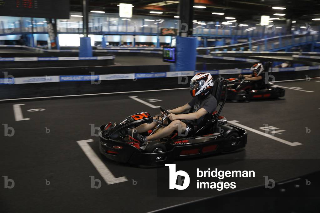 Teenagers riding go-karts in Wissous, France
