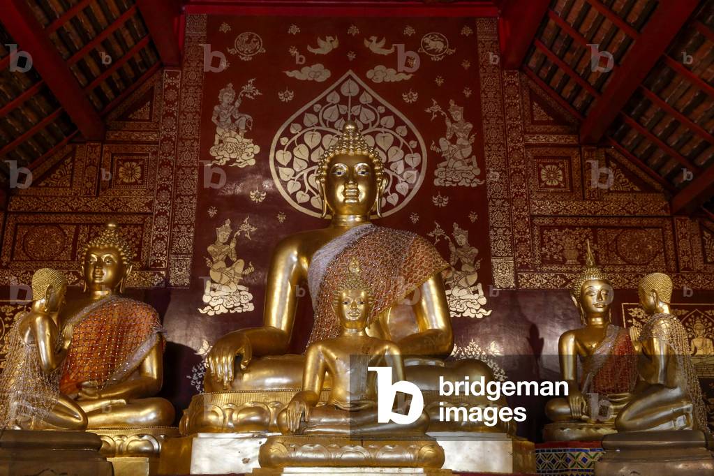 Buddha and disciple statues in Wat Pan Ping, Chiang Mai. Thailand