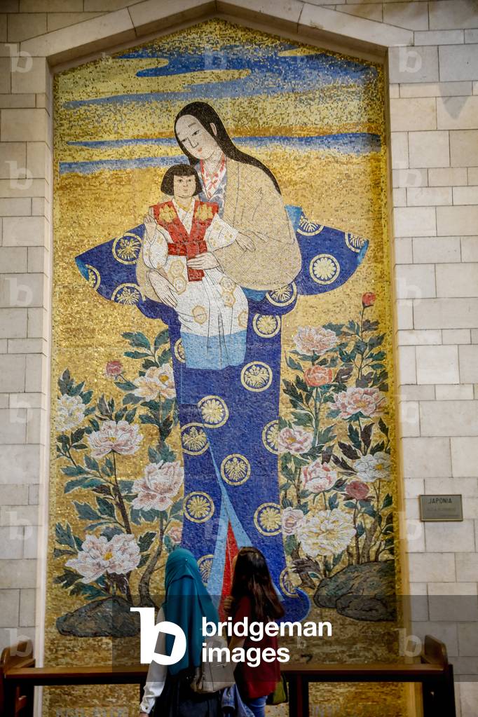 Visitors walking past a Japanese mosaic in the Annunciation Roman catholic basilica, Nazareth, Galilee, Israel, 2018 (photo)