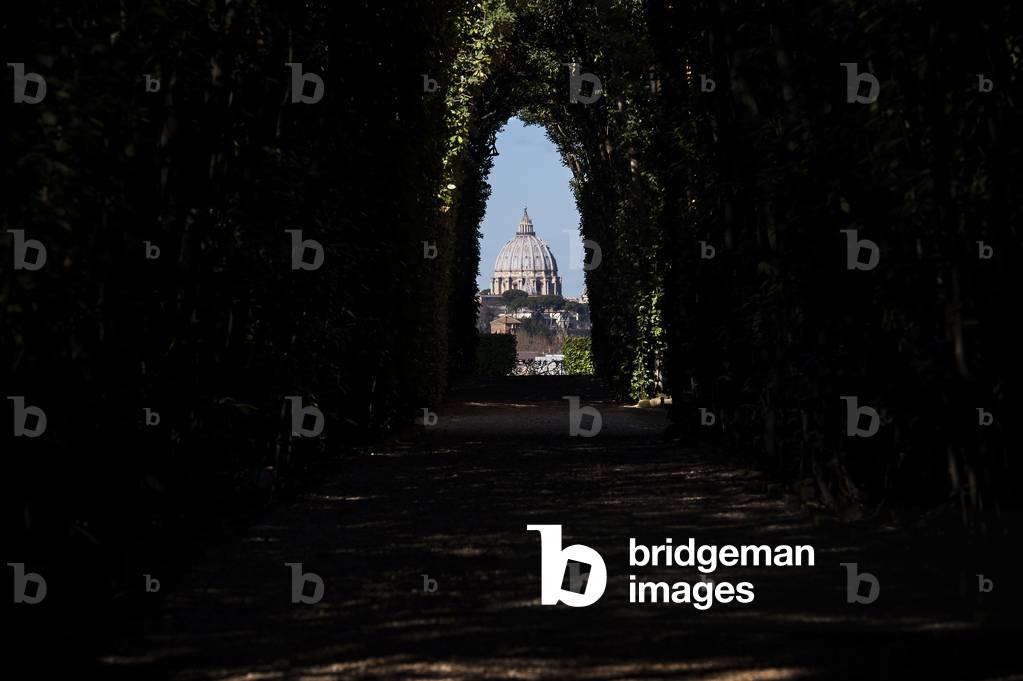 View of St. Peter's dome Villa del Priorato di Malta (or Magistral Villa), Rome, Italy, 2017 (photo)