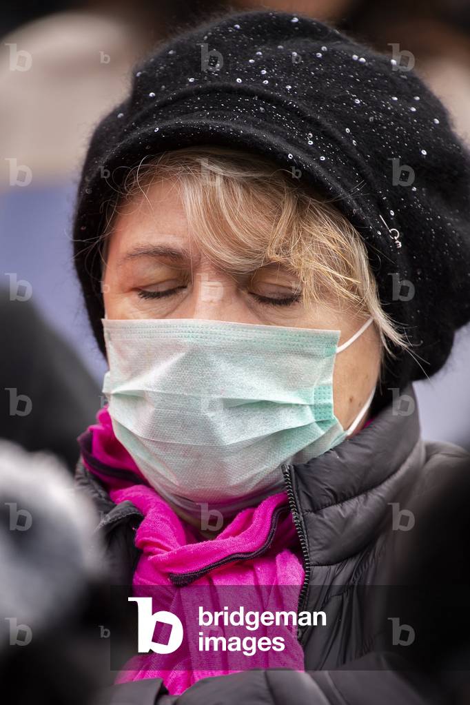 Catholic faithful wearing a face mask during Pope Francis's weekly general audience in St. Peter's square at the Vatican.