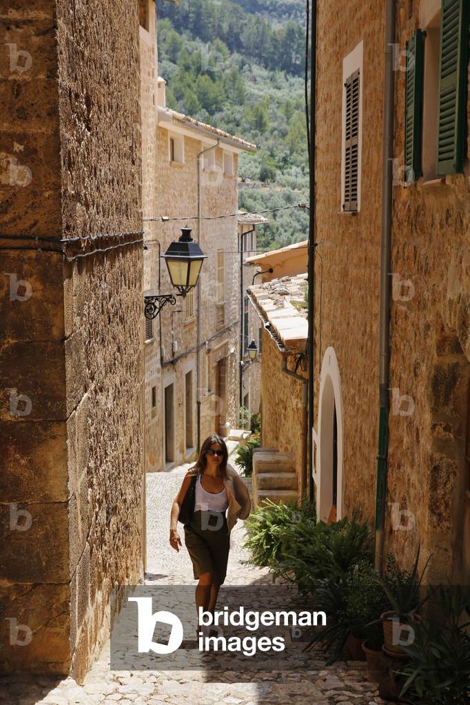 Woman walking in Fornalutx, Majorca, Fornalutx, Spain