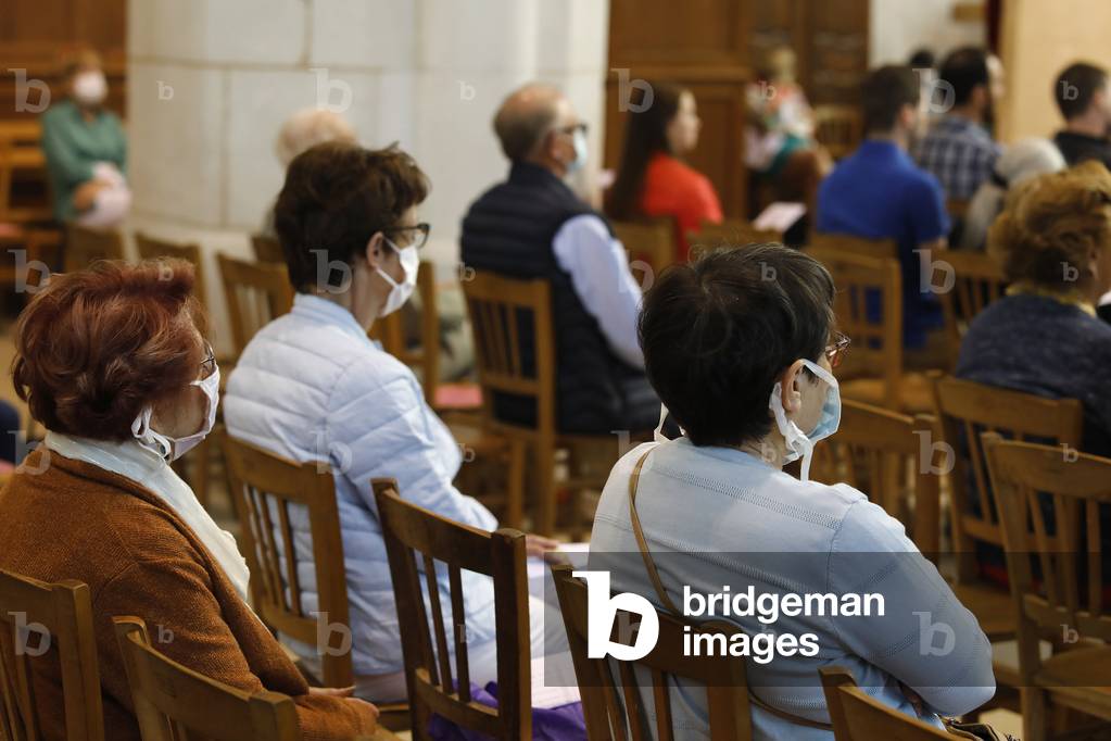 Pentecost mass in St Nicolas's church, Beaumont-le-Roger, France