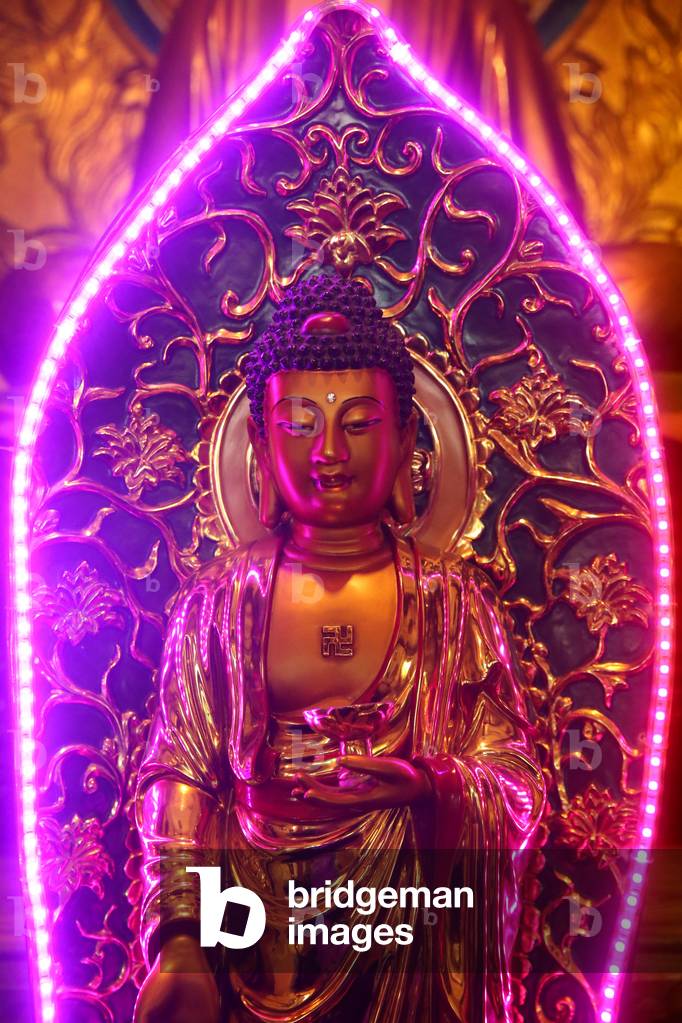 Chua Thien Hung buddhist pagoda. Buddha statue with neon light. Ho Chi Minh City. Vietnam