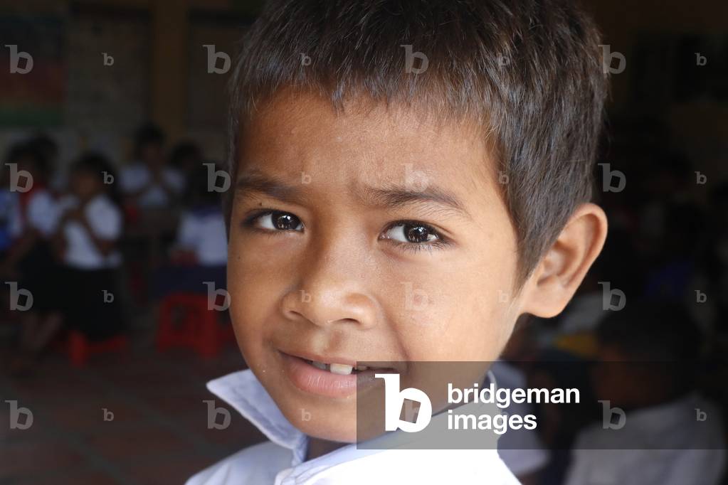 Young boy at school, Portrait, Kampot, Cambodia (photo)