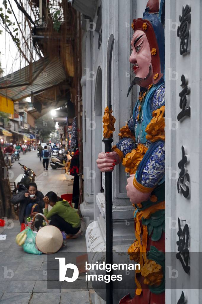 Cau Dong chinese buddhist temple. Guardian statue.  Hanoi. Vietnam. (photo)