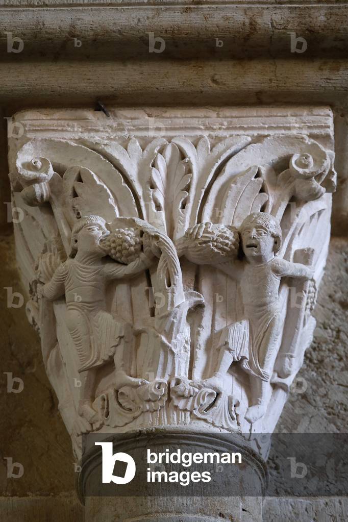 Saint Mary Magdalene basilica, Vezelay, France. Capital depicting men eating grapes
