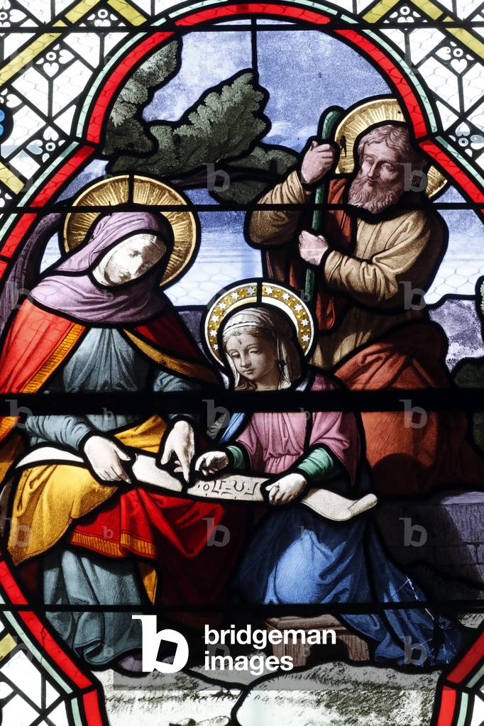 Saint Pierre church.  Stained glass window.  Saint Anne and Saint Joachim with Mary as a child. Beaume Les Messieurs. France.