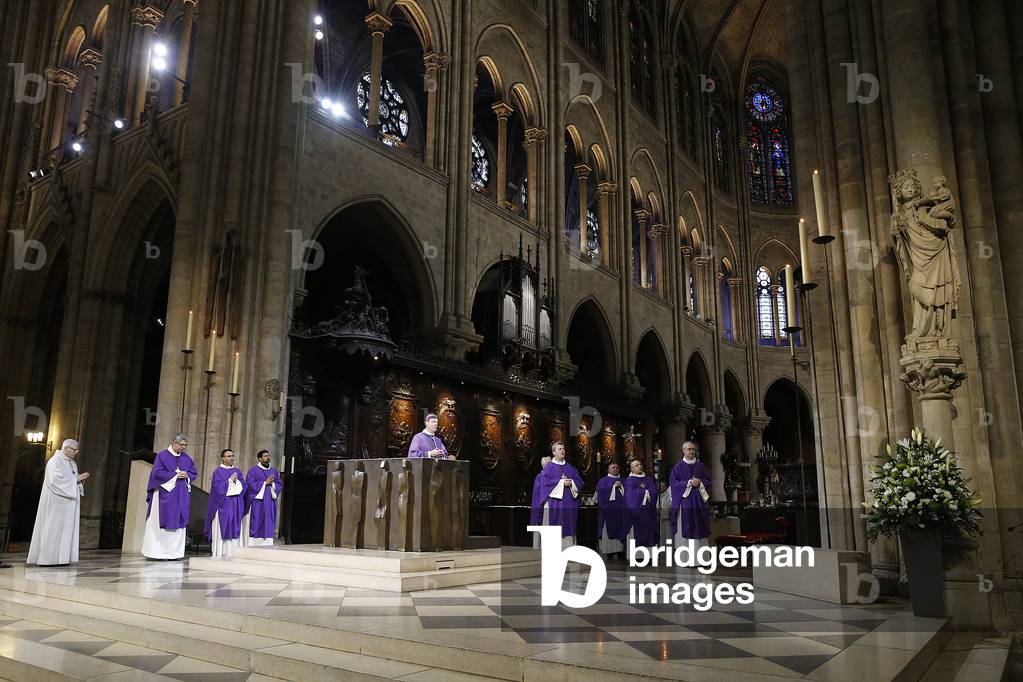 Ash wednesday celebration at Notre Dame cathedral, Paris, France, Prayer to Mary. (photo)