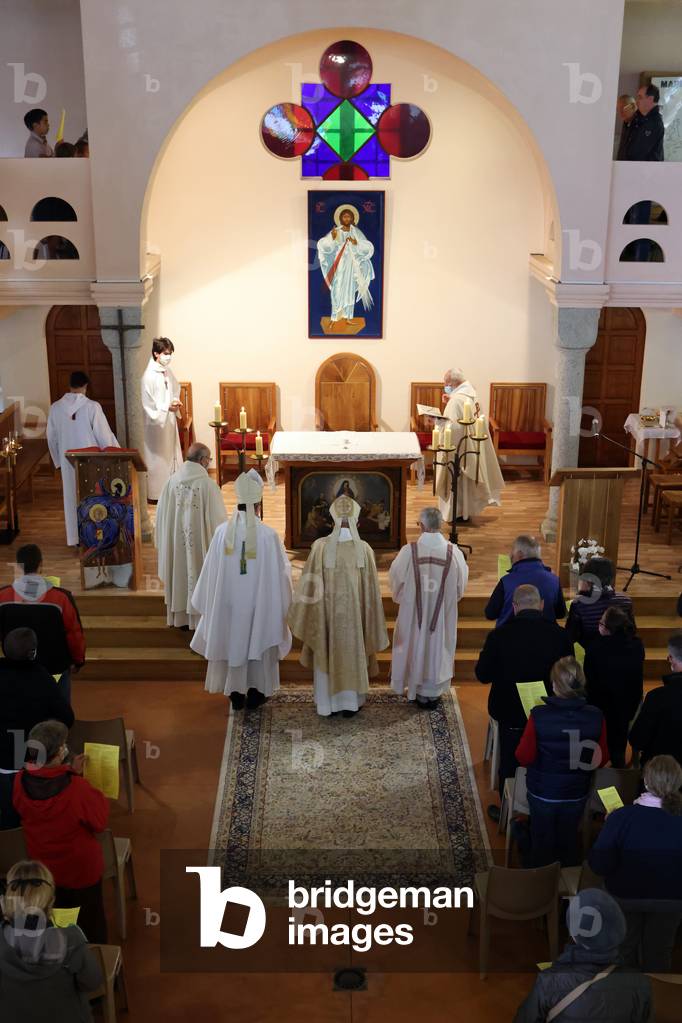 Catholic church during covid-19 epidemic.  Celebration of the mass.   Sanctuary of La Benite Fontaine. France.