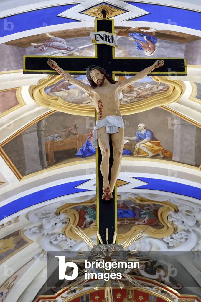 St. Nicolas de Veroce baroque church.  Crucifix. Jesus on the cross.  Painting.  France. (photo)