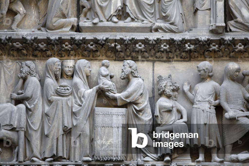 Notre Dame Cathedral ; North facade ; Cloister gate tympanum sculpture depicting the birth of Jesus Paris France