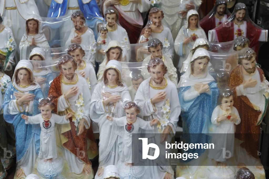 Shop selling religious christian items. Holy Virgin statues. Ho Chi Minh City. Vietnam
